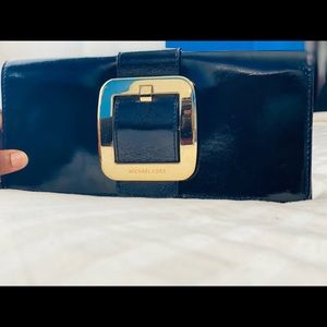 Micheal Kors Black and Gold Patent Leather Clutch